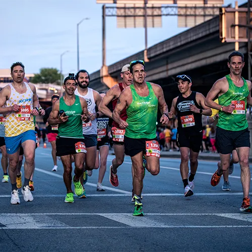 15k male runners near bridge