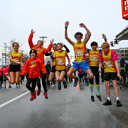 5k kids jumping in air