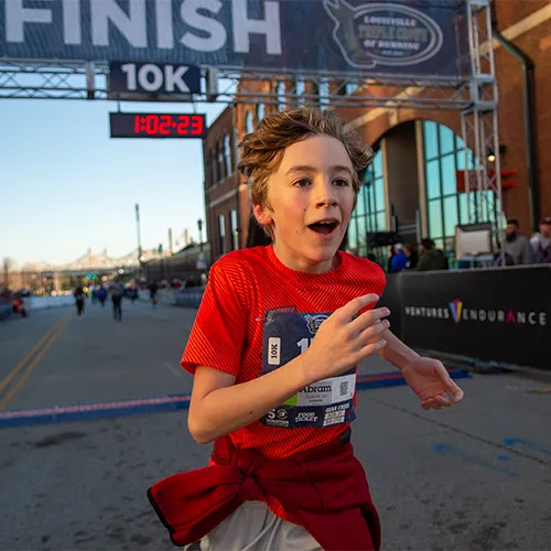 kid crossing finish line